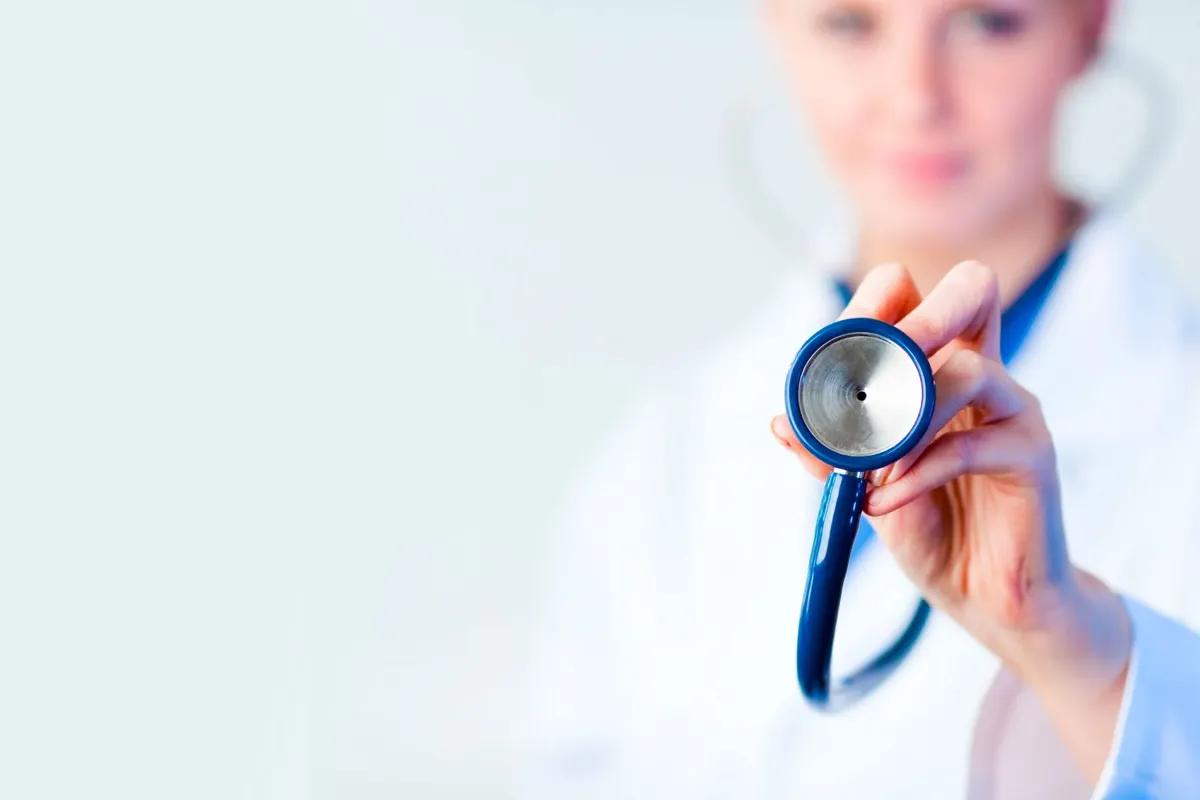 Occupational health practitioner holding a stethoscope