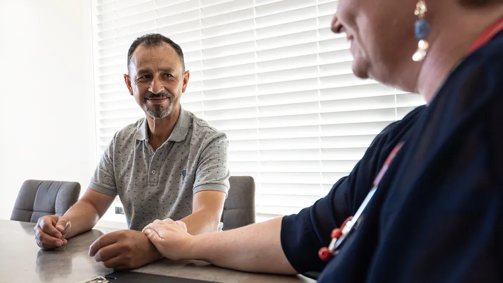 Dominique with a client during a workplace health check